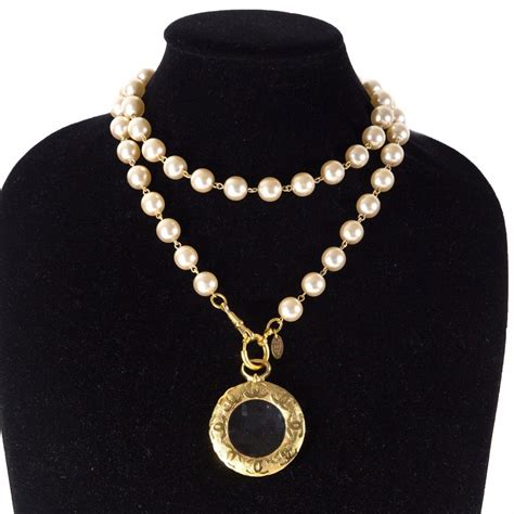 chanel necklace with pearls and logo|Chanel long necklace with logo.